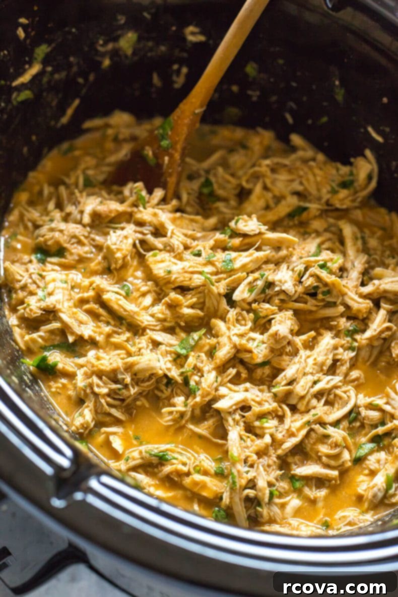 Tropical Crockpot Chicken Tacos with Pineapple Salsa 4 Ingredients for Crockpot Chicken Tacos being added to the slow cooker