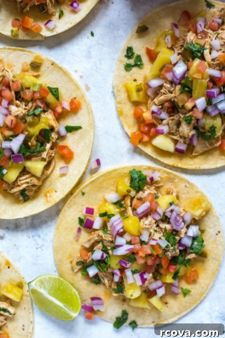 Tropical Crockpot Chicken Tacos with Pineapple Salsa 5 Shredded chicken for tacos in a slow cooker