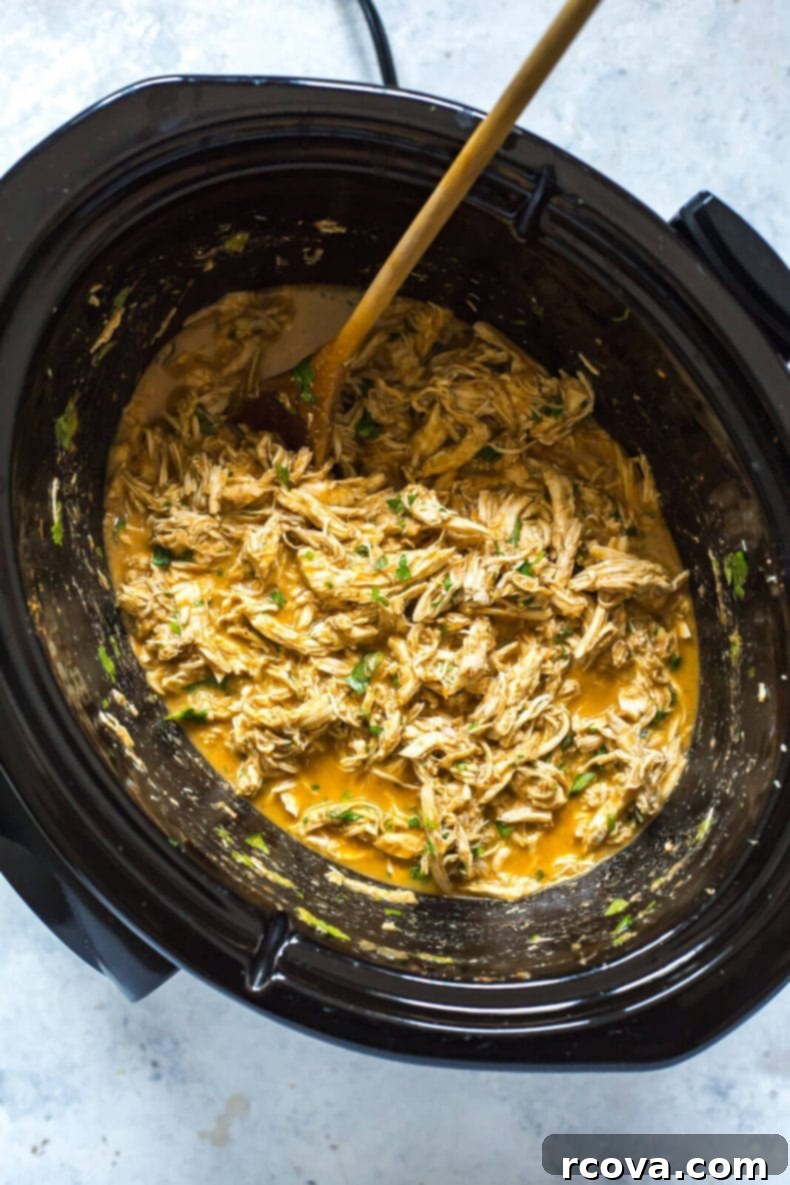 Tropical Crockpot Chicken Tacos with Pineapple Salsa 6 Close-up of freshly prepared Crockpot Chicken Tacos with pineapple salsa and cilantro