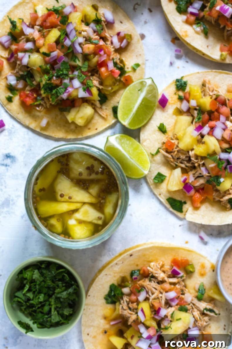 Tropical Crockpot Chicken Tacos with Pineapple Salsa 8 Crockpot Chicken Tacos prepared for meal prep in glass containers