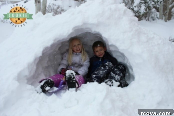 Strawberry Cloud Cookies 8 Kids playing in a snow cave after a big snow storm, showcasing family fun beyond baking.