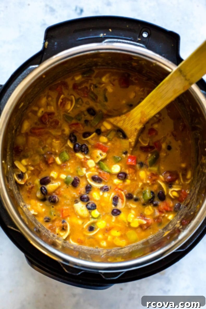 Instant Pot Vegetarian and Gluten Free Taco Soup 5 Serving bowls of vegetarian Instant Pot Taco Soup with toppings