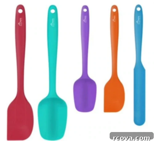Culinary Curation: Gifts for Gourmet & Get-Ahead Cooks 10 Assortment of silicone spatulas in various shapes and sizes, essential for versatile cooking and baking.
