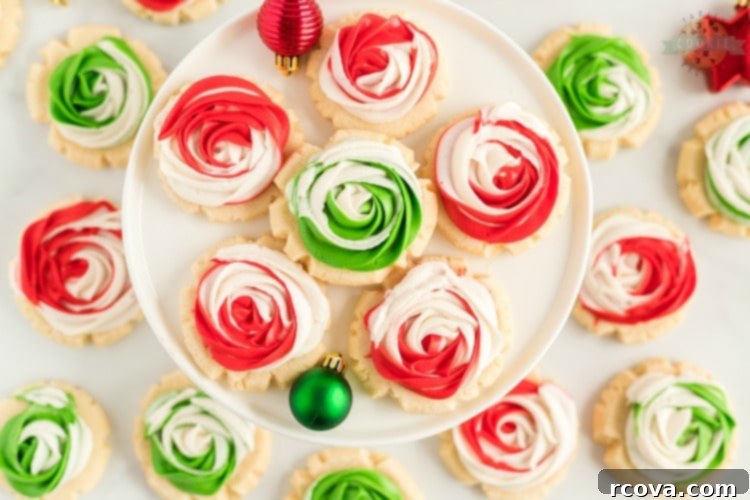 Iced Rose Sugar Cookies 2 Frosted Rose Sugar Cookies are buttery, soft sugar cookies with a delicious swirled rosette on top! This sugar cookie recipe doesn’t require any chilling and you don’t have to roll them out either! Elegant Sugar Cookies that look like roses that are perfect as gifts!