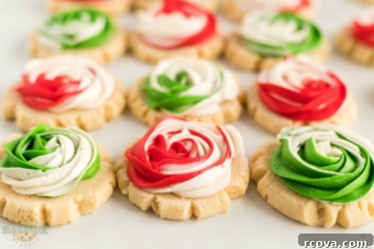 Iced Rose Sugar Cookies 3 Frosted Rose Sugar Cookies are buttery, soft sugar cookies with a delicious swirled rosette on top! This sugar cookie recipe doesn’t require any chilling and you don’t have to roll them out either! Elegant Sugar Cookies that look like roses that are perfect as gifts!