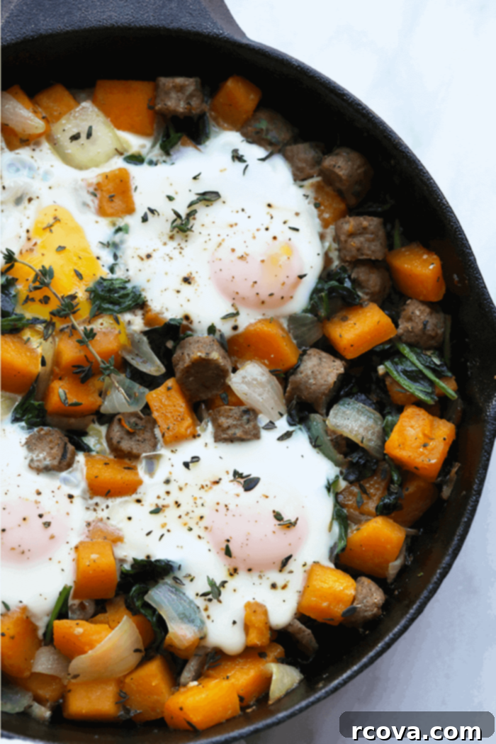 Autumn's Best: 40+ Butternut Squash Recipes to Savor 4 Butternut squash breakfast hash in a skillet with baked eggs on top