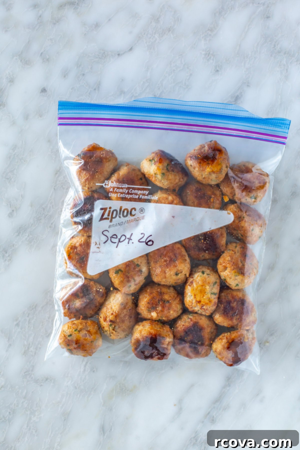 Effortless Oven Baked Turkey Meatballs 9 Baked turkey meatballs in a freezer bag, labeled for storage.