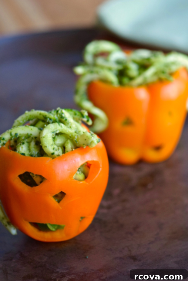 Wholesome Haunts: Healthy Halloween Feasts 14 Zucchini noodles served in carves bell peppers