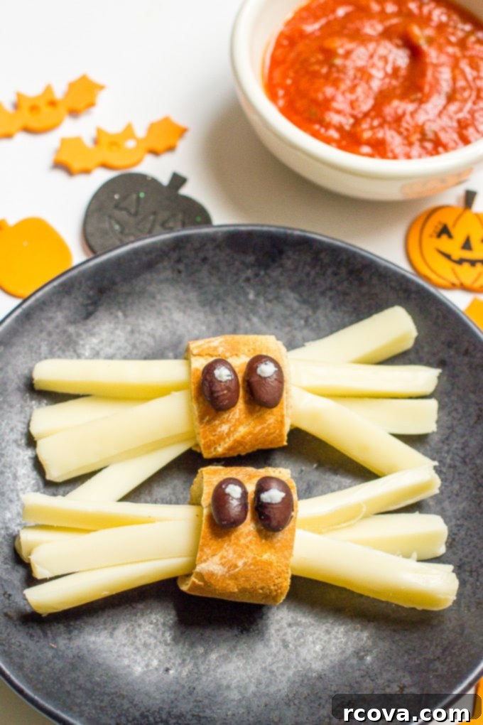 Wholesome Haunts: Healthy Halloween Feasts 8 String cheese in the shape of spiders
