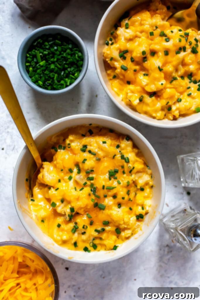 Decadent Low Carb Cauliflower Mac and Cheese 2 Creamy Cauliflower Mac and Cheese served in a rustic bowl, garnished with fresh parsley, highlighting its low-carb and keto-friendly appeal.