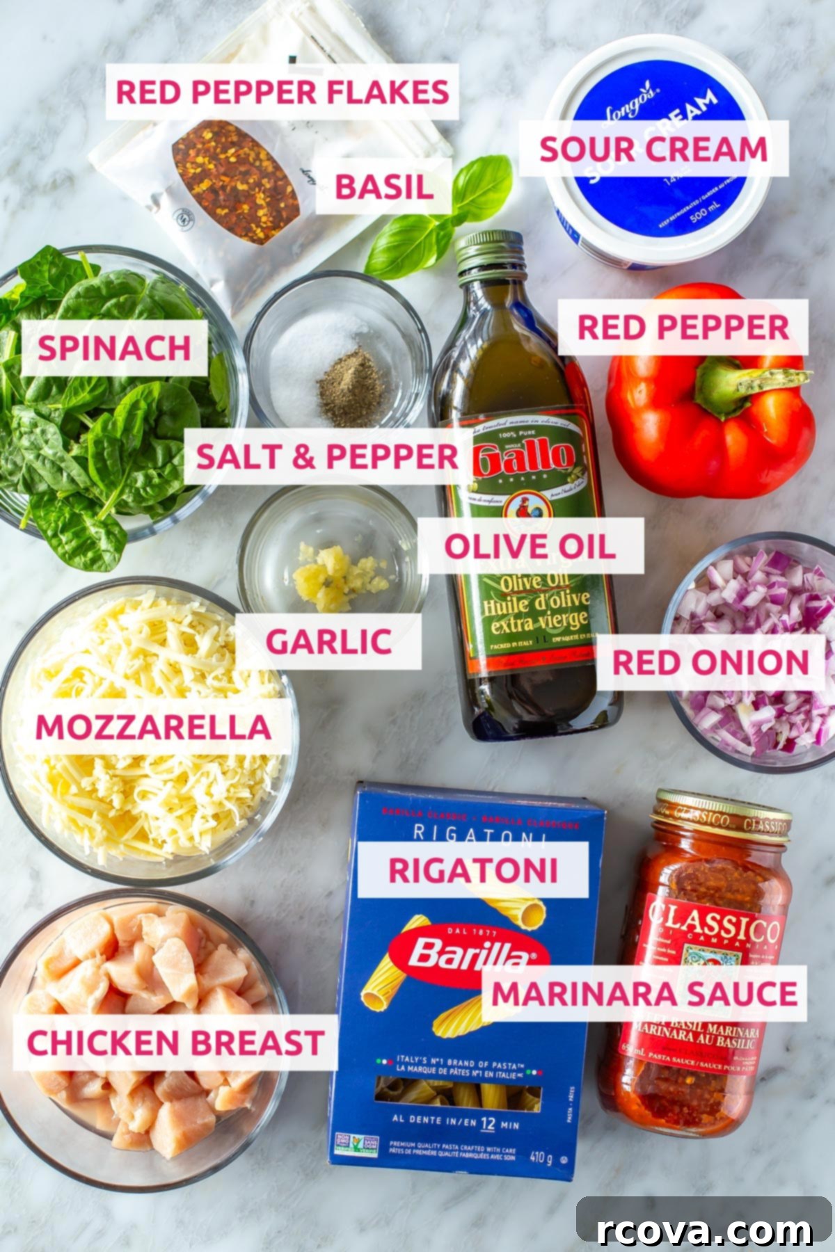 Quick & Cheesy Chicken Pasta Bake 4 Ingredients for chicken pasta bake: chicken breasts, rigatoni, marinara sauce, mozzarella, garlic, olive oil, red onion, red pepper, spinach, salt, pepper, sour cream, basil and red chili flakes.
