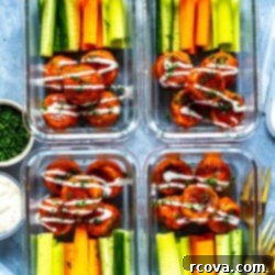 Lean Buffalo Chicken Meatballs 9 Healthy Buffalo Chicken Meatballs plated with fresh vegetables