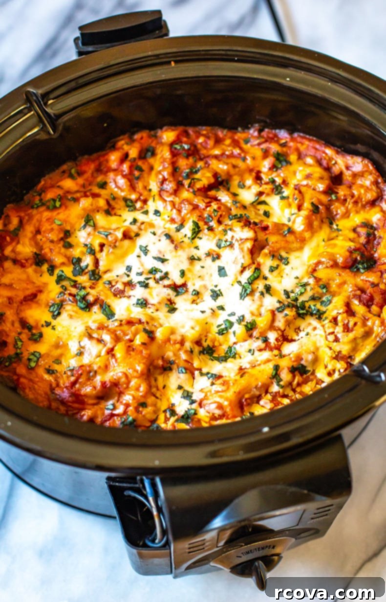 Effortless Weekly Meal Prep 19 A bubbling Crockpot Lasagna, cooked to perfection and ready to be served or portioned for meal prep.