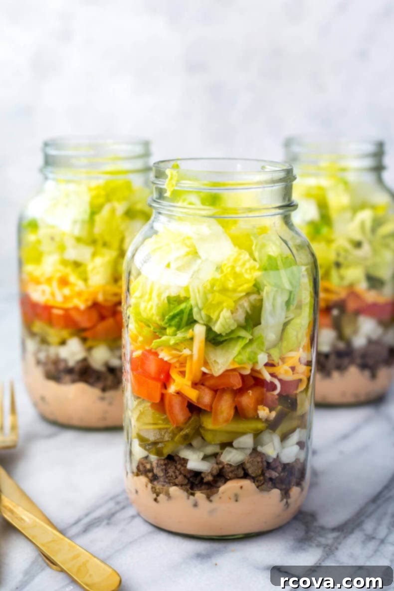 Effortless Weekly Meal Prep 5 Organized meal prep containers with healthy food inside.