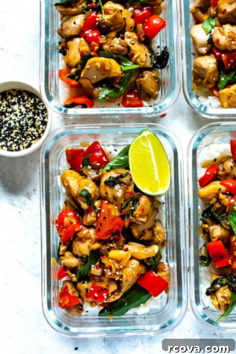 Effortless Thai Basil Chicken 3 Meal Prep Thai Basil Chicken served over white rice with sesame seeds.