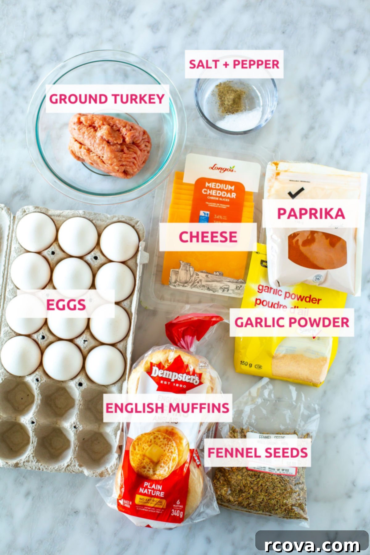 Better Than The Drive-Thru Sausage Egg Muffin 3 All the fresh ingredients for homemade sausage egg McMuffins laid out on a wooden board: ground turkey, salt, pepper, cheddar cheese slices, paprika, garlic powder, fennel seeds, fresh eggs, and English muffins.
