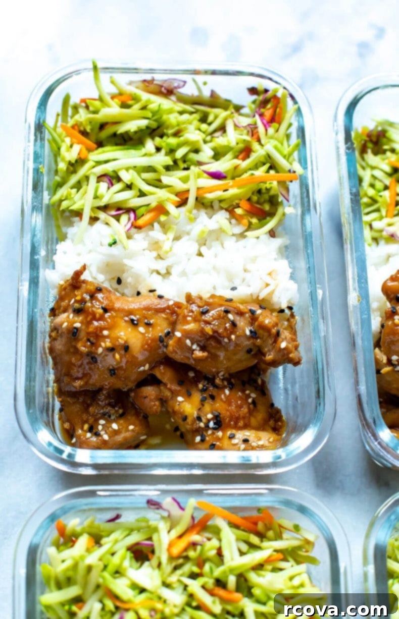 These Garlic Sesame Instant Pot Chicken Thighs are perfect for your weekly meal prep and they are covered in the best sticky, sweet sauce - serve with rice and veggies for a full meal! #instantpot #chickenthighs Close-up of a glass meal prep container with Garlic Sesame Chicken Thighs, rice, and broccoli slaw, showcasing a healthy and ready-to-eat dinner