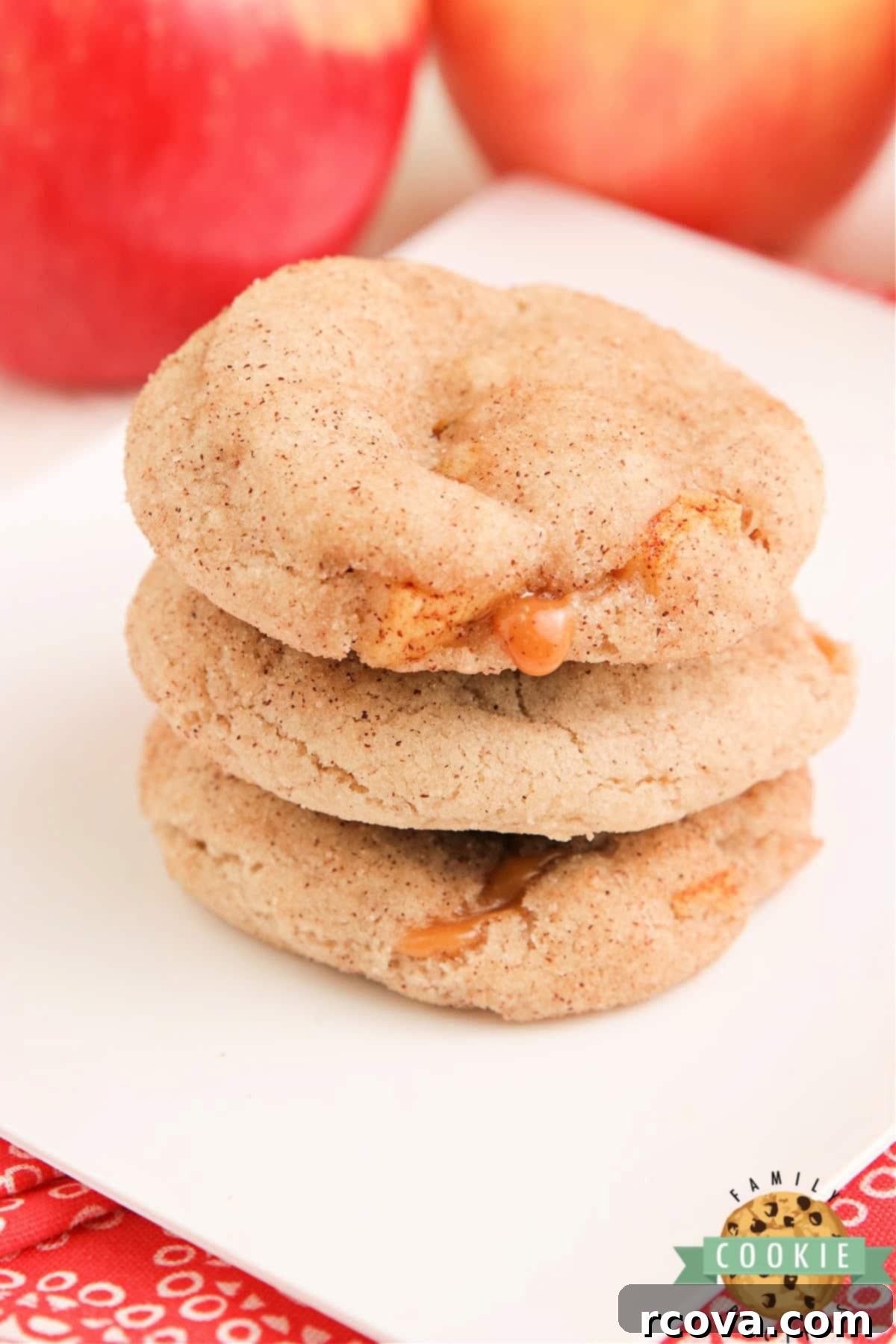 Caramel Apple Snickerdoodles 8 Soft and chewy Caramel Apple Snickerdoodles, filled with gooey caramel, arranged on a baking sheet.