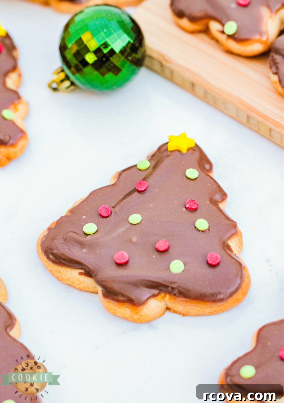 Festive Twix Christmas Tree Cookies 12 Sugar cookie topped with caramel and chocolate.