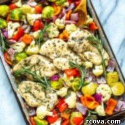 Easy 30-Minute Sheet Pan Rosemary Chicken 3 Close-up of a perfectly roasted Sheet Pan Rosemary Chicken with golden-brown skin and tender vegetables.