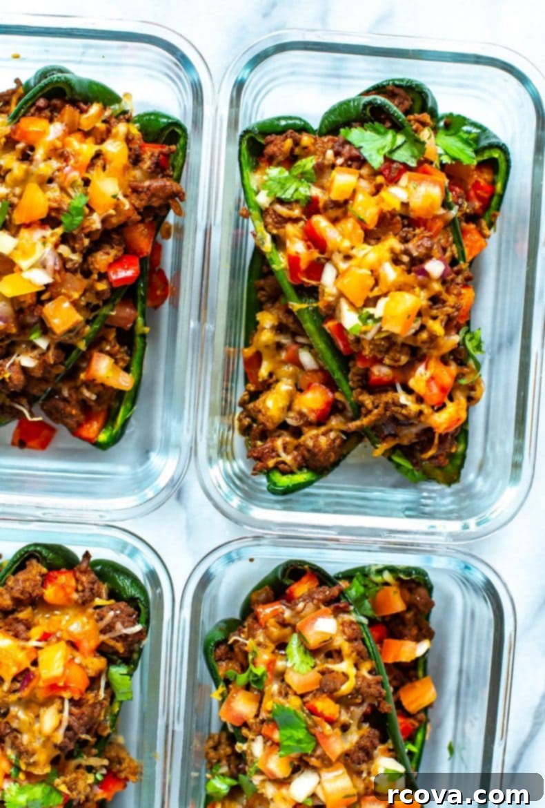 Keto Friendly Stuffed Poblano Delight 10 A serving of low-carb stuffed poblano peppers on a plate with fresh toppings and cutlery.