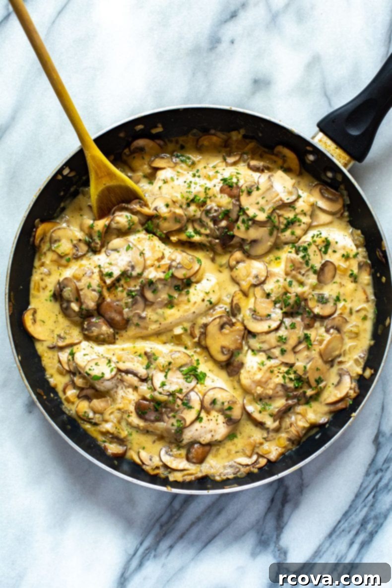 This Skinny, Easy Chicken Marsala Skillet is a delicious, creamy mushroom chicken recipe, made healthier with less cream and Marsala wine. It's a one-pan dinner that's freezer-friendly! making an easy chicken Marsala recipe in a skillet, showing the cooking process of chicken and mushrooms