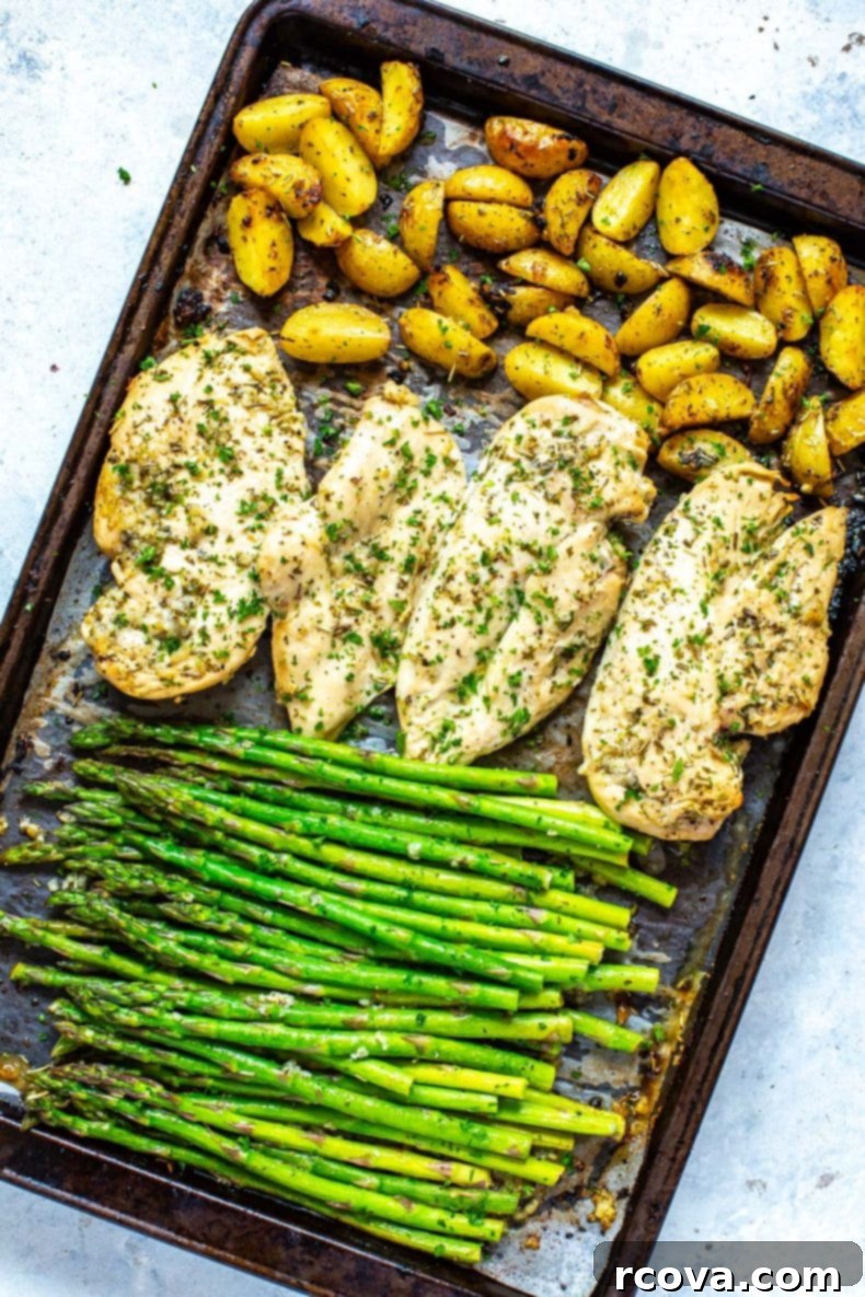 This Sheet Pan Chicken and Asparagus with lemony potatoes is one of our favourite simple chicken recipes. This healthy, Whole30 approved meal prep recipe comes together in less than 30 minutes! Tender baby potatoes, perfectly cooked chicken cutlets, and fresh asparagus spears artfully arranged on a single sheet pan, ready to be enjoyed.