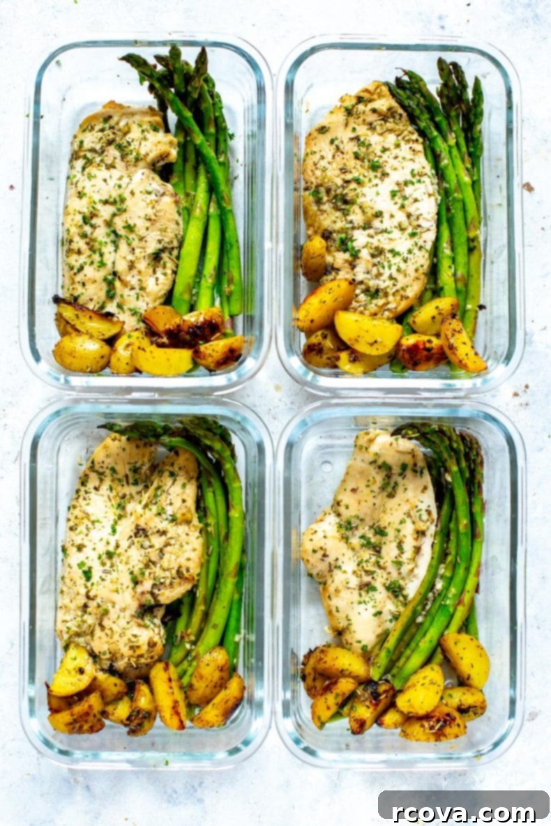 Golden Chicken and Asparagus Roast 6 A vibrant, close-up shot of a serving of Sheet Pan Chicken and Asparagus on a white plate, garnished with fresh herbs, showcasing the golden chicken, tender potatoes, and bright green asparagus.
