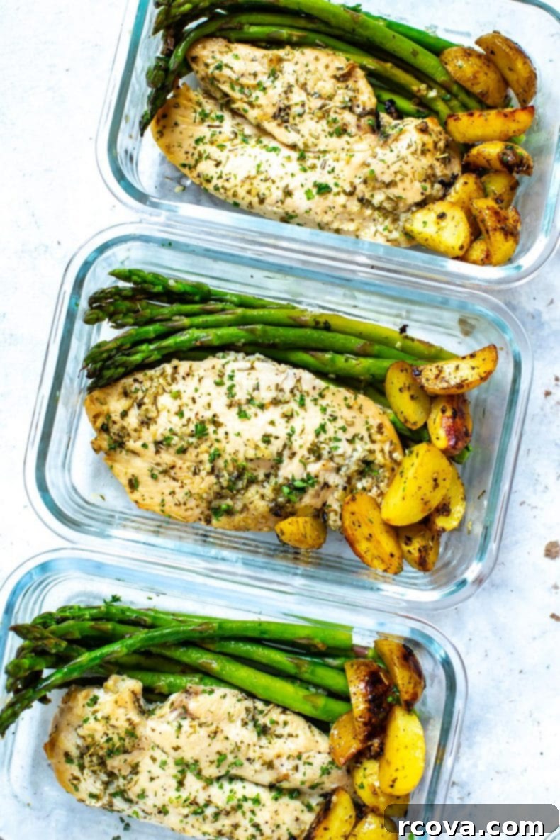 Golden Chicken and Asparagus Roast 8 A close-up shot of a large sheet pan filled with perfectly roasted lemon-herb chicken, tender asparagus, and golden baby potatoes, ready to be served family-style.