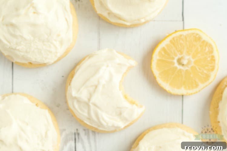 Vibrant Lemon Jello Sugar Cookies 3 Close-up of a stack of frosted lemon jello sugar cookies showing their soft texture