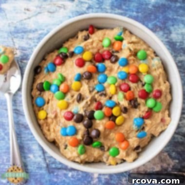No-Bake Monster Cookie Dough 7 Edible Monster Cookie Dough in a bowl with a spoon.