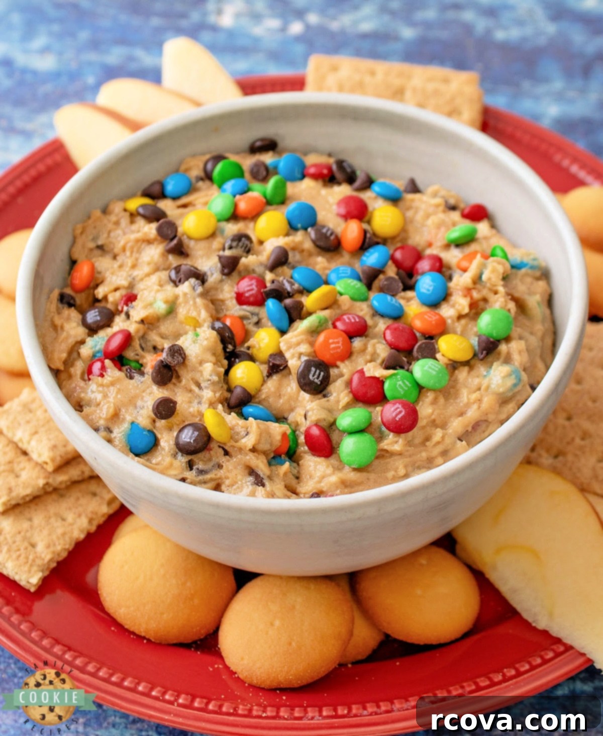 No-Bake Monster Cookie Dough 8 A large bowl of edible cookie dough, served with vanilla wafers and graham crackers for dipping.