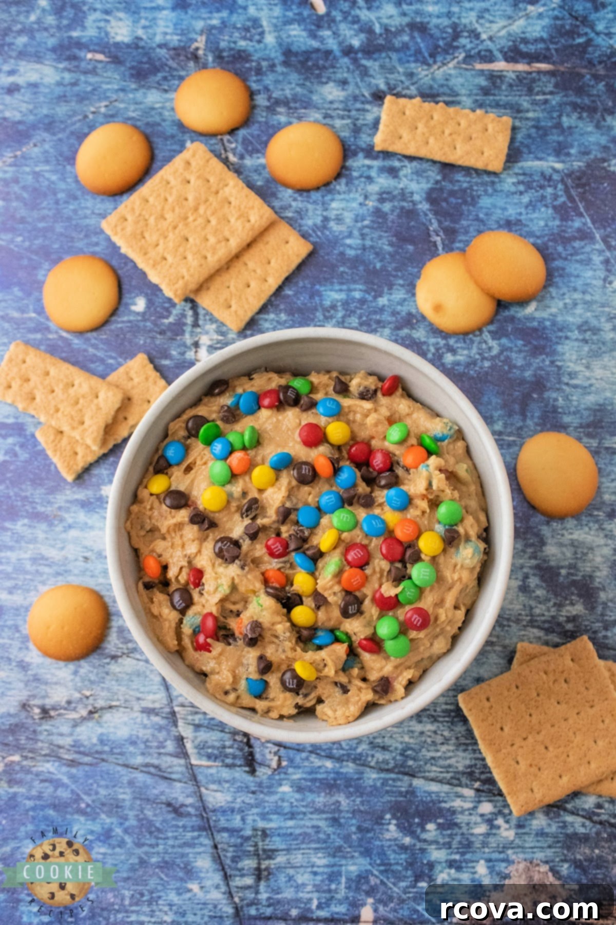 No-Bake Monster Cookie Dough 9 A bowl of rich edible monster cookie dough, highlighting its vibrant colors and tempting texture.