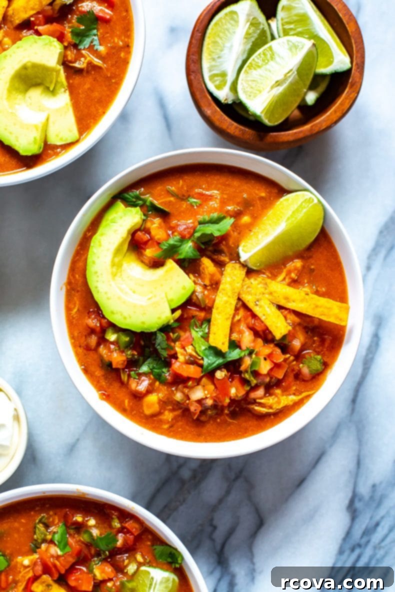 This Instant Pot Chicken Enchilada Soup is a delicious copycat of Chili's enchilada soup recipe. It's made healthier and easily using pantry staples! You'll love this Mexican soup!  Instant Pot Chicken Enchilada Soup