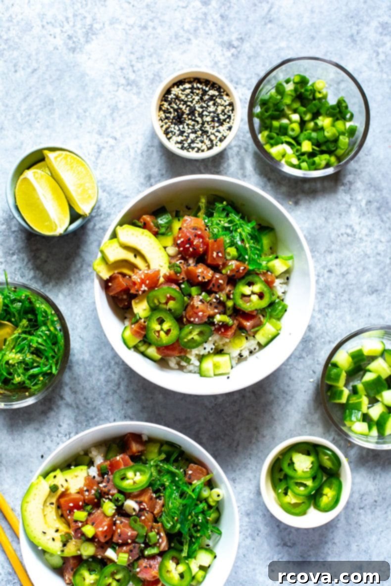 This 30-Minute Ahi Poke Bowl is a quick Hawaiian-inspired recipe with marinated tuna, sushi rice, avocado and seaweed salad - it's just like takeout! A beautifully presented Hawaiian Poke Bowl featuring marinated raw tuna steak, sushi rice, and an array of fresh toppings.