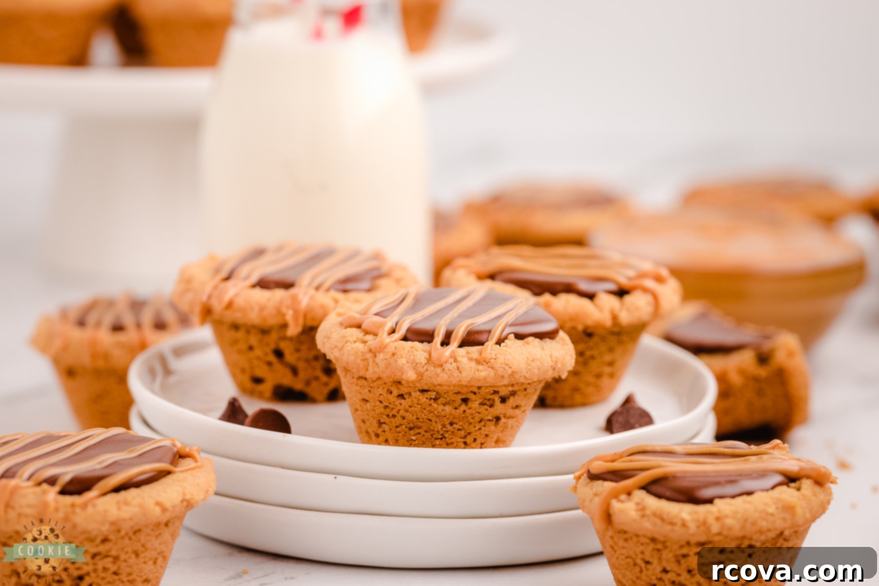 Decadent Peanut Butter Fudge Cookie Cups 11 fudge peanut butter cookie cups on a white plate with milk