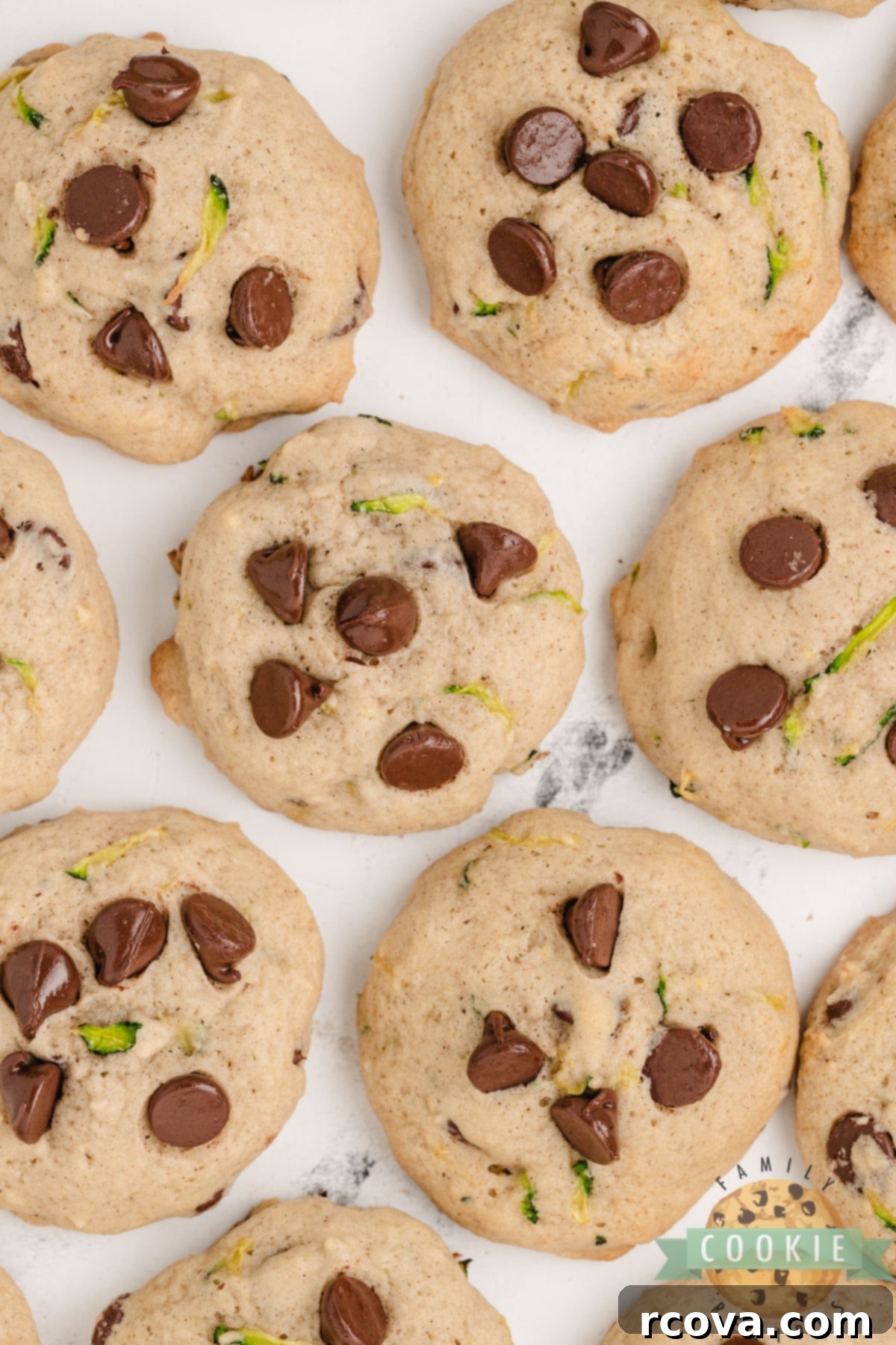 Hidden Veggie Chocolate Chip Delights 13 A generous plate of freshly baked Zucchini Chocolate Chip Cookies, ready to be served.