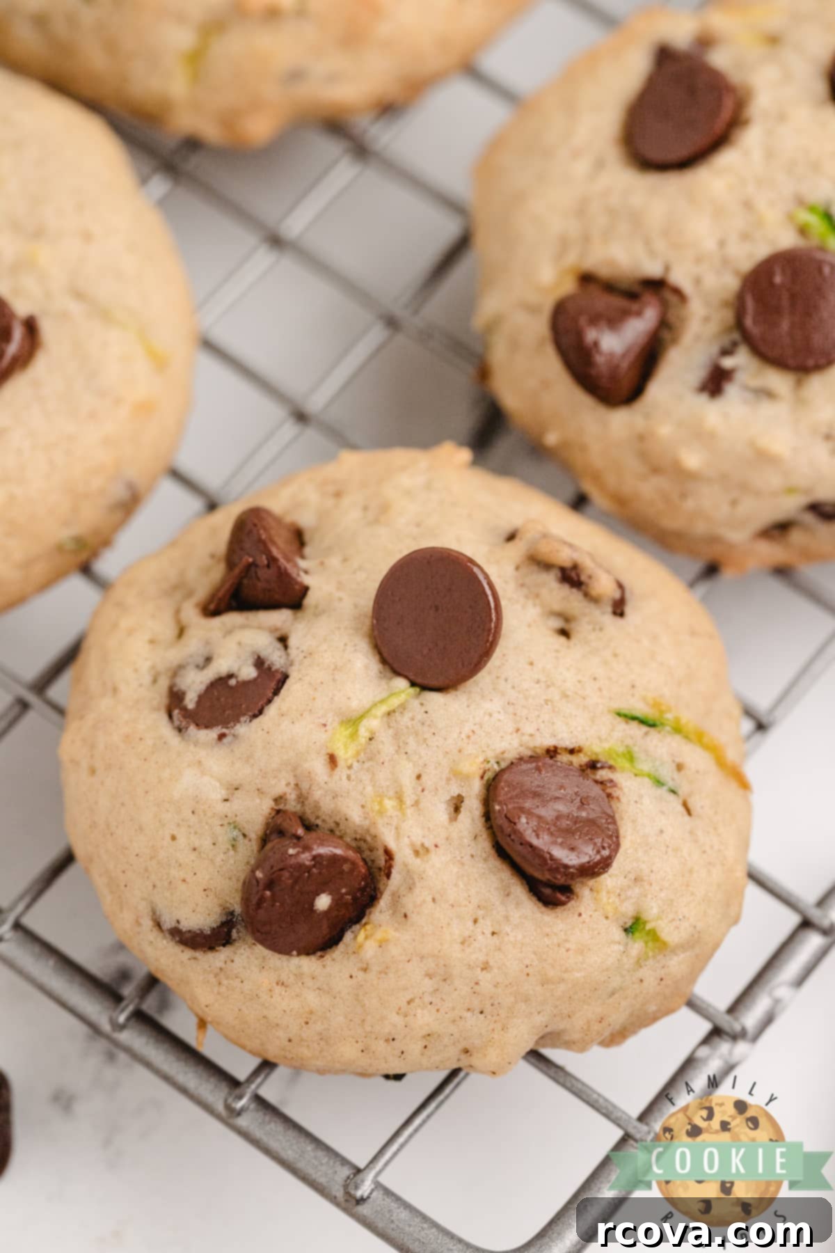 Hidden Veggie Chocolate Chip Delights 15 Various freshly baked Zucchini Chocolate Chip Cookies, showcasing their appealing golden-brown edges and soft centers.