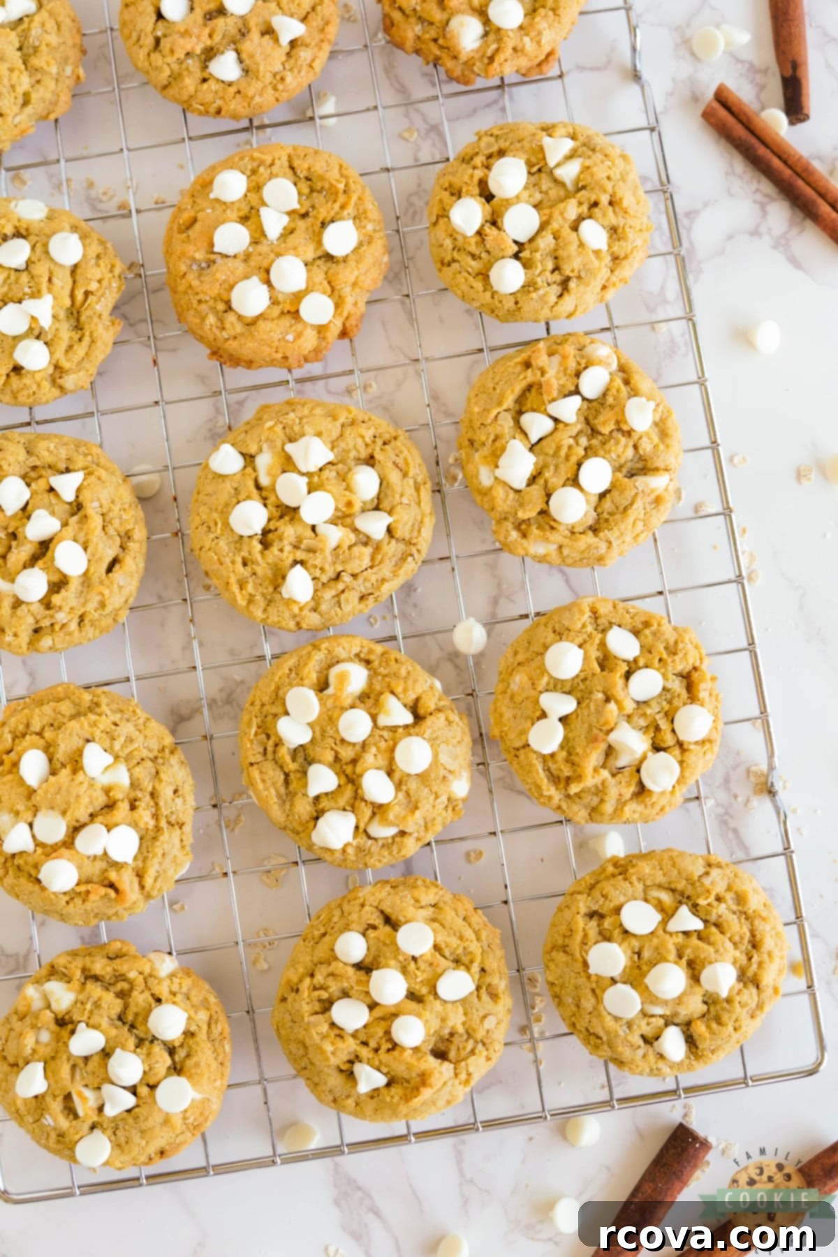 Golden Pumpkin White Chocolate Oat Jewels 11 Warm pumpkin cookies with melted white chocolate chips cooling on a wire rack after being baked to perfection.