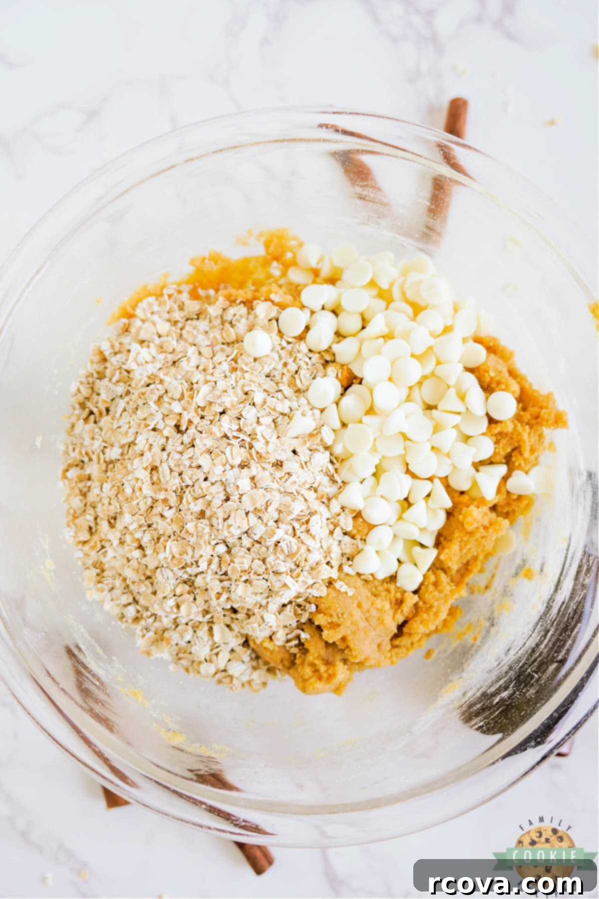 Golden Pumpkin White Chocolate Oat Jewels 9 Folding in wholesome oats and sweet white chocolate chips into the prepared pumpkin cookie dough.