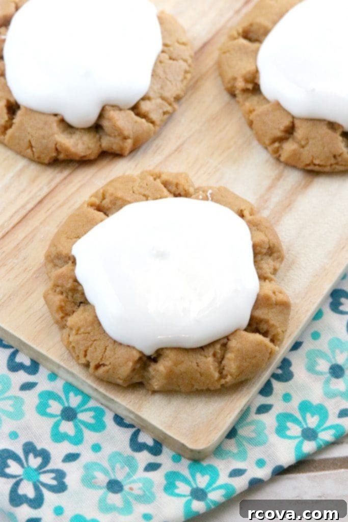 Gooey Fluffernutter Cookies 4 Close-up of Fluffernutter Cookies, showing the texture of the peanut butter base and the marshmallow topping.