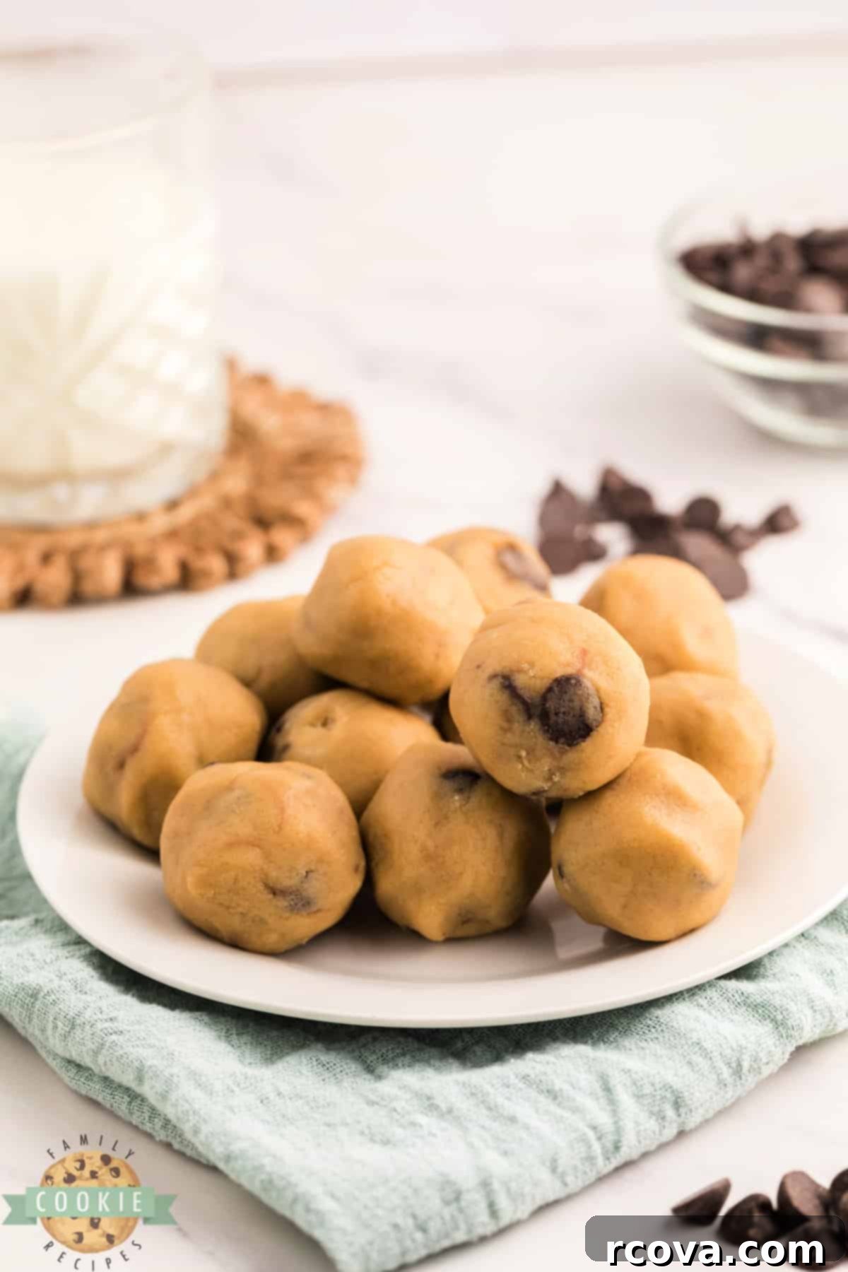 Indulgent Chocolate Chip Dough Gems 14 A bowl overflowing with delightful balls of edible chocolate chip cookie dough, ready for snacking.