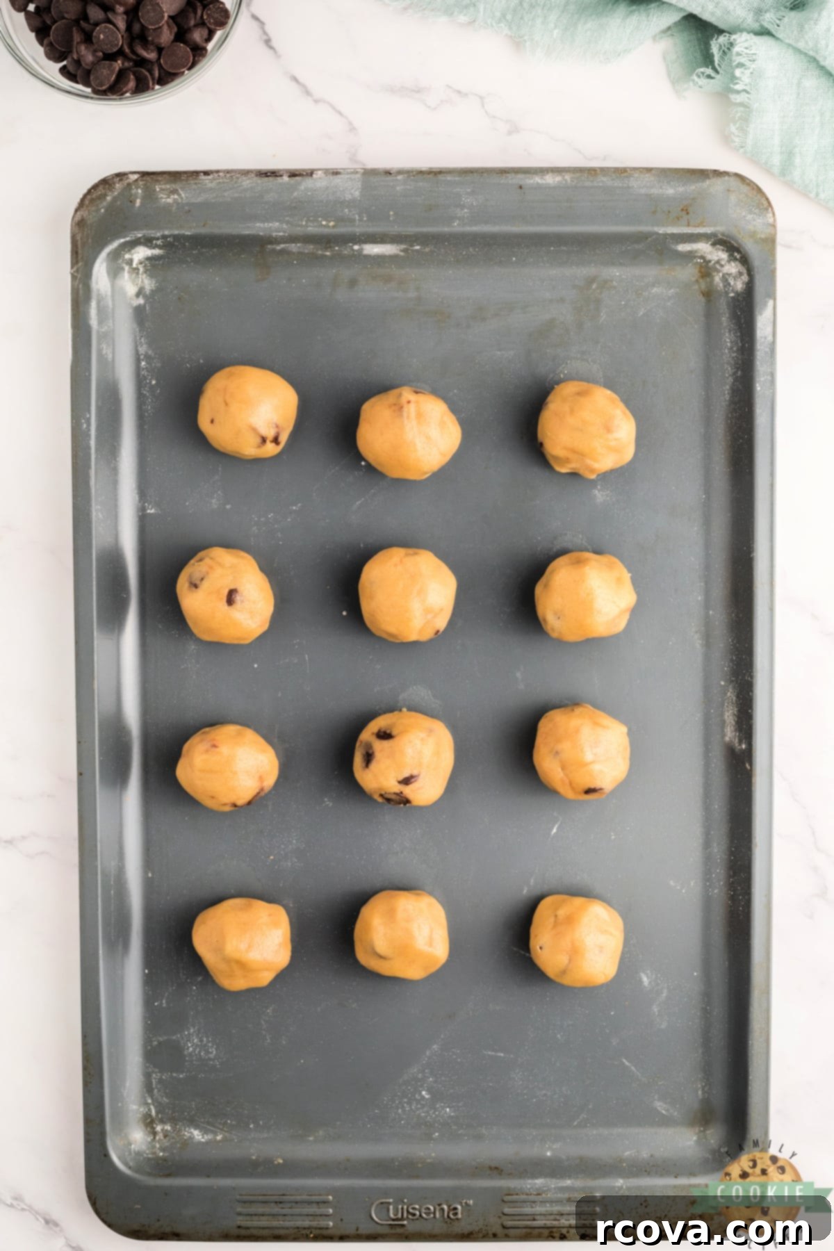 Indulgent Chocolate Chip Dough Gems 9 Scoops of edible cookie dough rolled into small, uniform balls and placed on a baking sheet.
