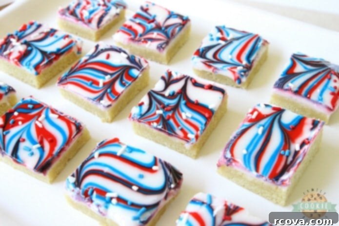 Marbled Patriotic Cookie Bars 2 Fun Patriotic Cookie Bars made with swirled red, white & blue icing making them perfectly festive! Easy sugar cookie bar recipe for 4th of July & Memorial Day.