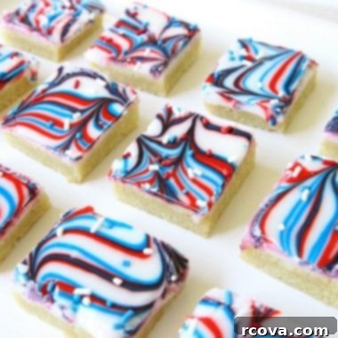 Marbled Patriotic Cookie Bars 4 Fun Patriotic Cookie Bars made with swirled red, white & blue icing making them perfectly festive! Easy sugar cookie bar recipe for 4th of July & Memorial Day.