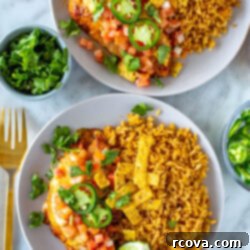 Tequila Lime Chicken Just Like Applebees 6 Two plates of tequila lime chicken served alongside rice.