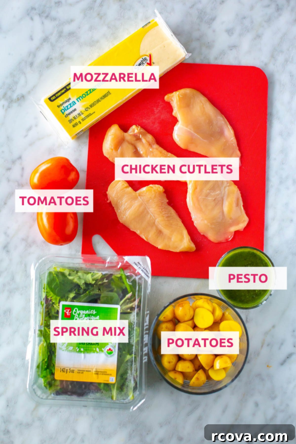 One-Pan Pesto Chicken Bake 4 Ingredients for baked pesto chicken dinner: chicken cutlets, pesto, mozzarella, potatoes, tomatoes, and spring mix.