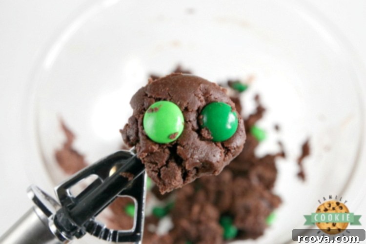 Effortless Mint Chocolate Cookies 4 A scoop of luscious mint chocolate cake mix cookie dough on a baking sheet