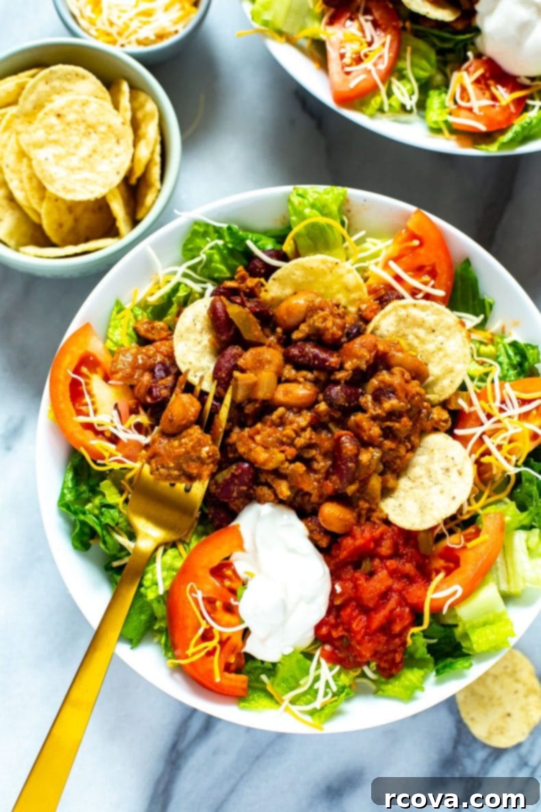 A delicious and healthy homemade Wendy's Taco Salad recipe, perfect for meal prep. Homemade version of Wendy's Taco Salad with chili, ready to serve and enjoy.