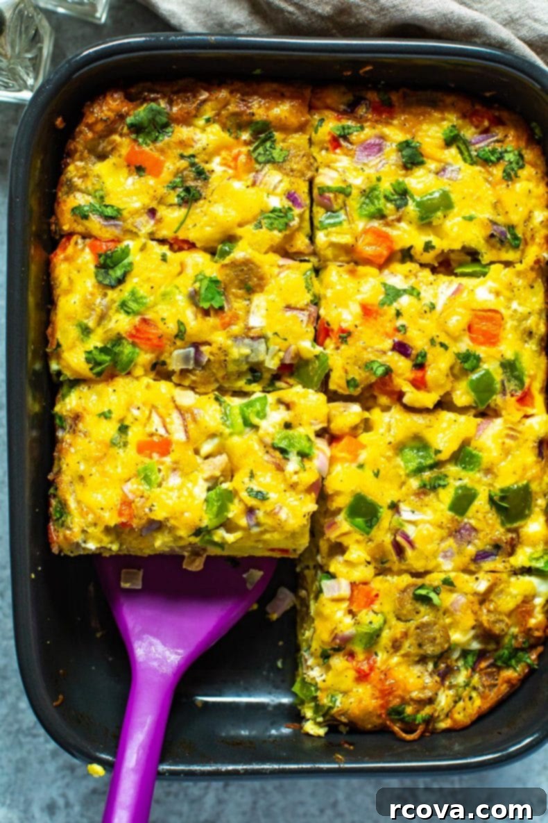 This Sausage Hashbrown Breakfast Casserole is made healthier thanks to turkey breakfast sausage and less cheese - it's a great meal prep idea that is also freezer-friendly! Ultimate Sausage Hashbrown Breakfast Casserole, freshly baked and ready to be served for a hearty breakfast meal.
